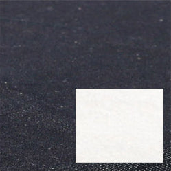 A close-up of the textured black surface of the 100% Natural Materials Orthopedic Dog Bed, featuring a white rectangular patch in the lower right corner.