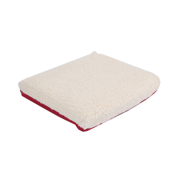 The 100% Natural Materials Orthopedic Dog Bed is square-shaped with a plush, cream-colored fleece-like top and a red fabric bottom, shown against a white background.